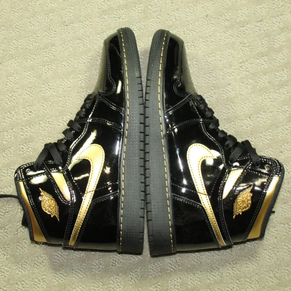 New IOB Jordan Boy's Size 6.5Y/ Women's 8 Black Patent Gold High Top Sneakers